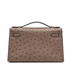 Kelly Pochette in Ostrich Leather with Gold Hardware Gris Tourterelle