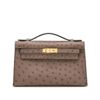 Kelly Pochette in Ostrich Leather with Gold Hardware Gris Tourterelle